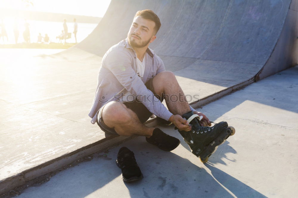 Similar – Bearded man sitting on dumpster