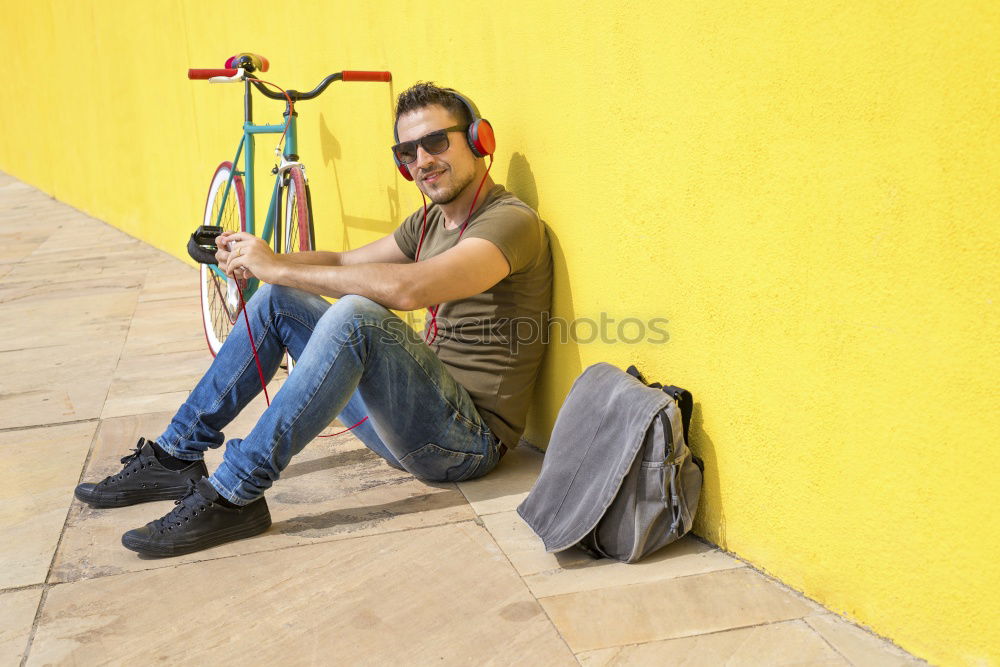 Similar – Side view of a young hipster man with a fixed bike