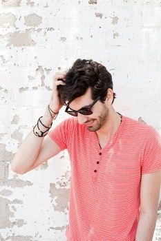 Similar – young handsome man with t-shirt against a wall in street