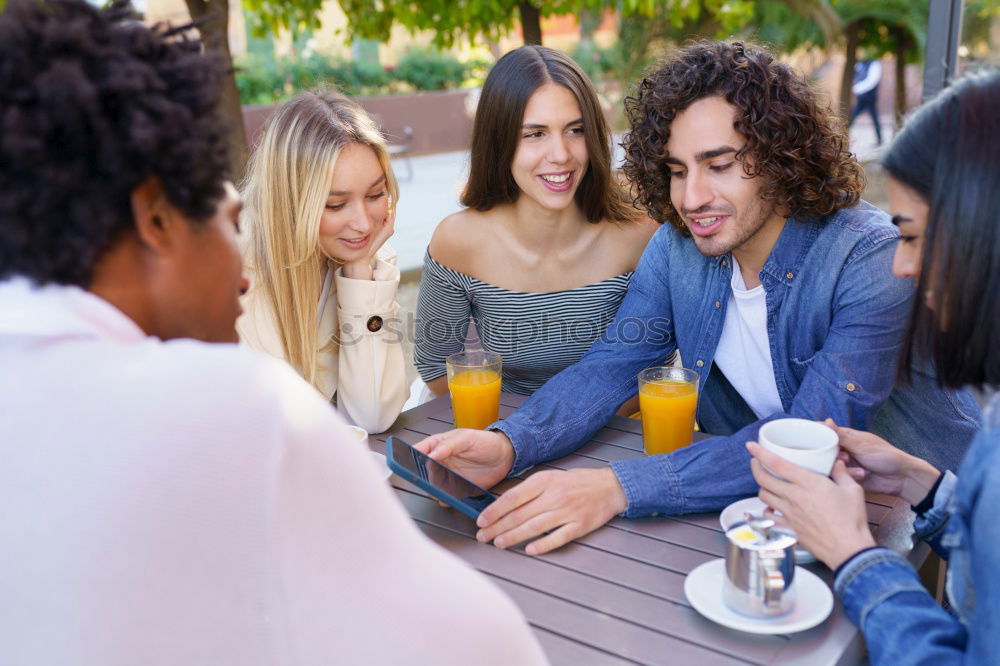 Similar – Image, Stock Photo Multiracial group of five friends having a coffee together.