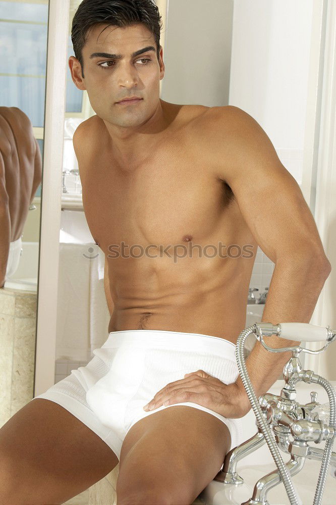 Similar – Young sexy pensive man sitting on bed