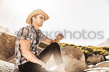 Bearded man in hat against sunlight