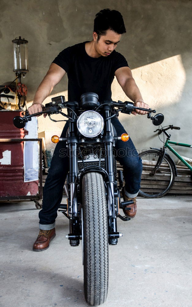 Similar – Image, Stock Photo Biker taking motorbike to the garage