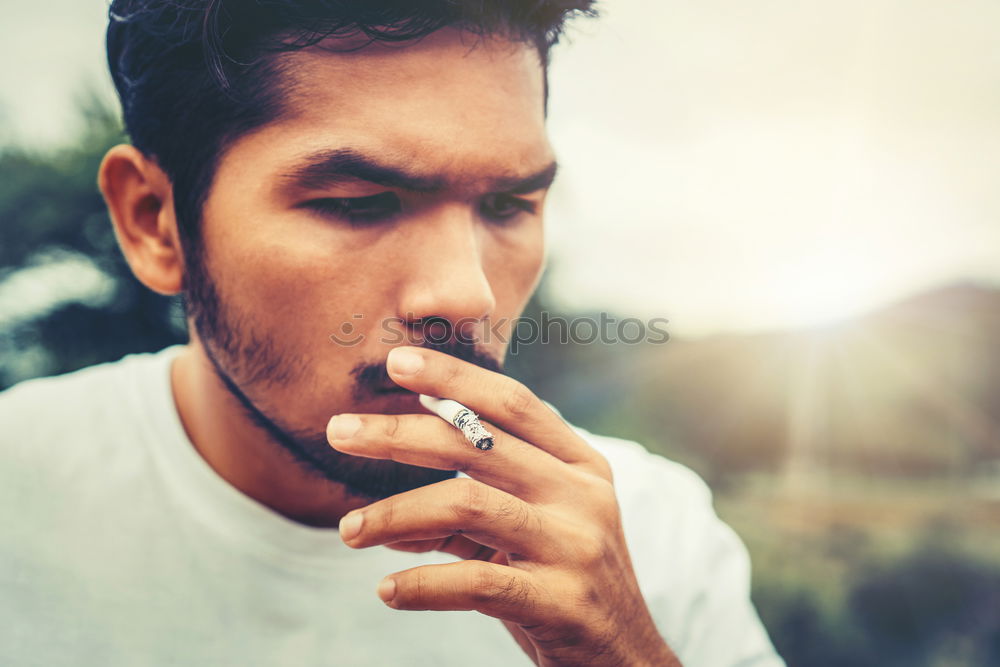 Similar – Image, Stock Photo Confident attractive mulatto man smoking a cigarrette