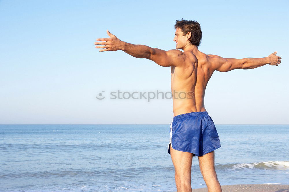 Similar – Image, Stock Photo young male playing with dog on beach during sunrise