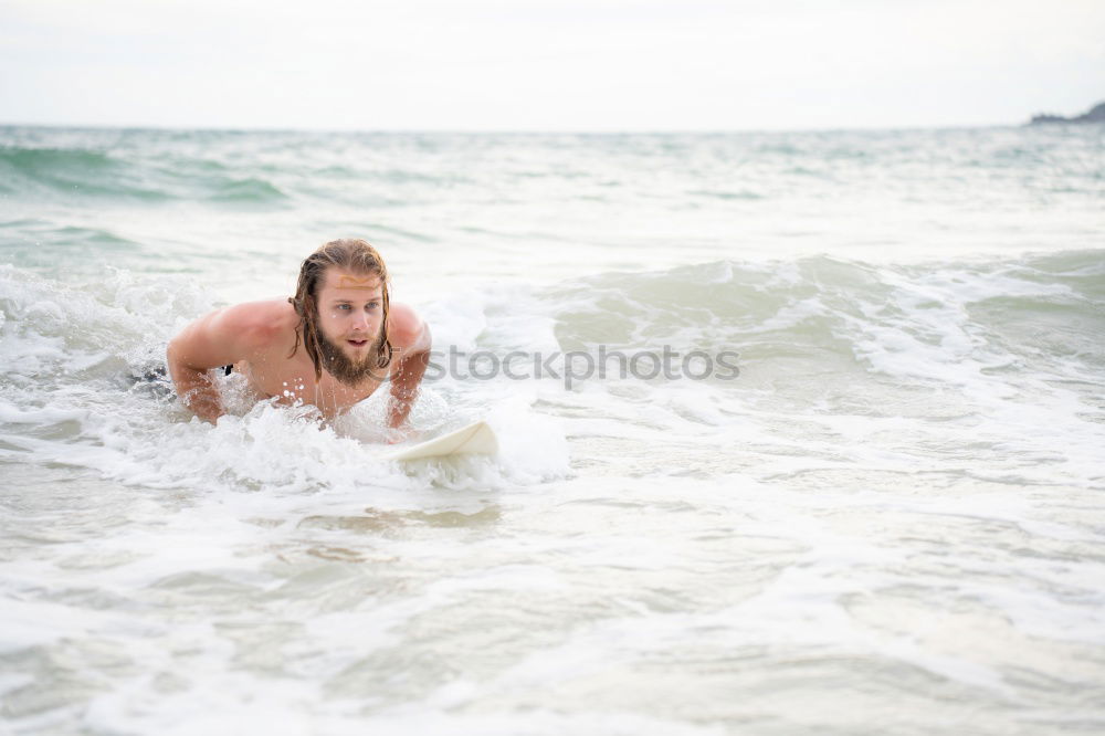 Similar – Young man enjoying the high waves in the sea