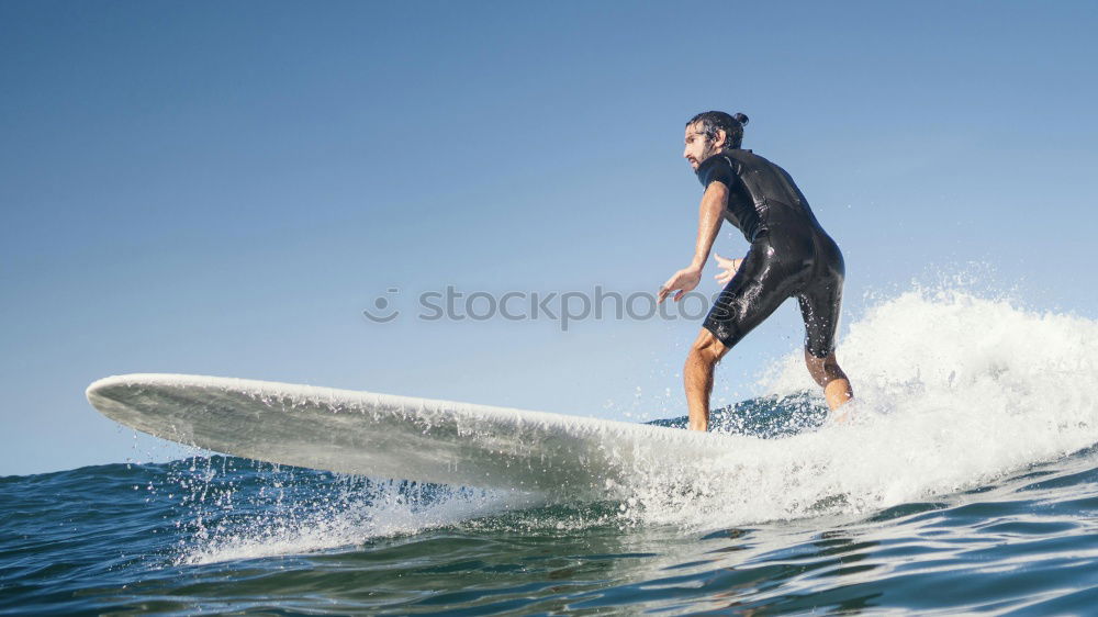 Similar – Image, Stock Photo Man in wetsuit swimming in ocean