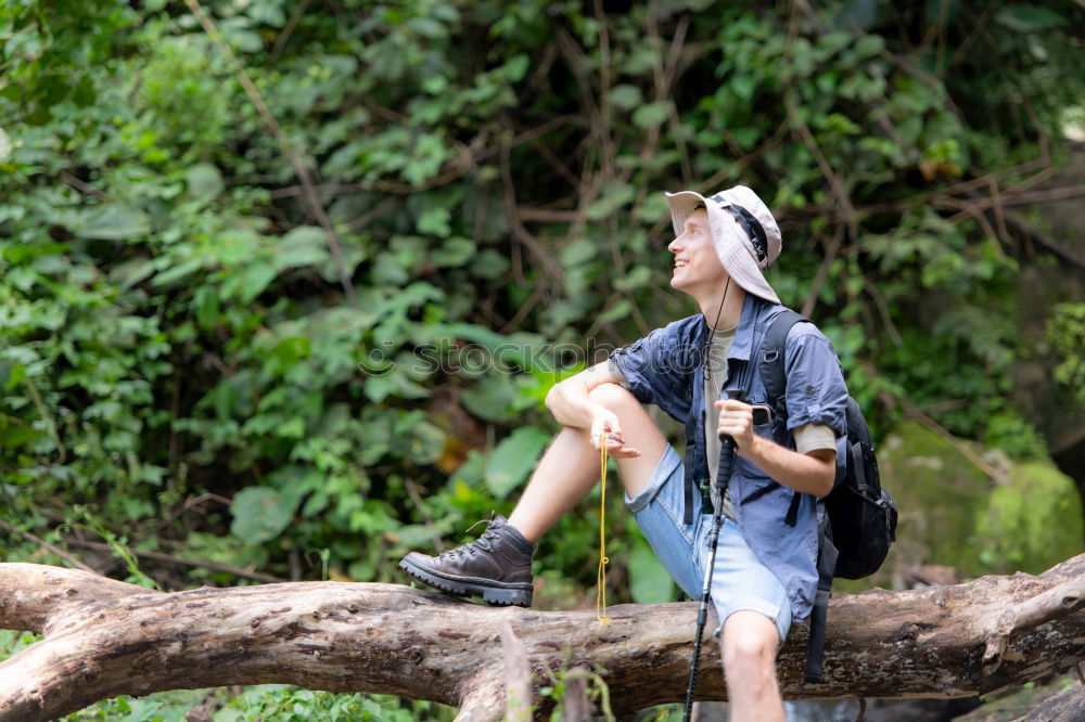 Similar – Image, Stock Photo Couple pausing while doing trekking