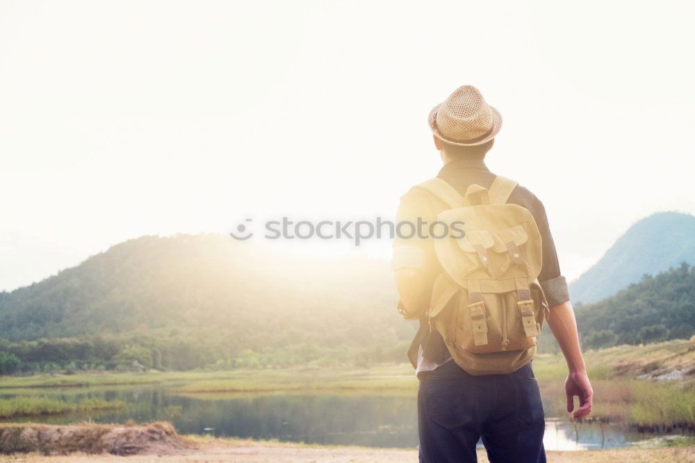 Tourist man at lake Man