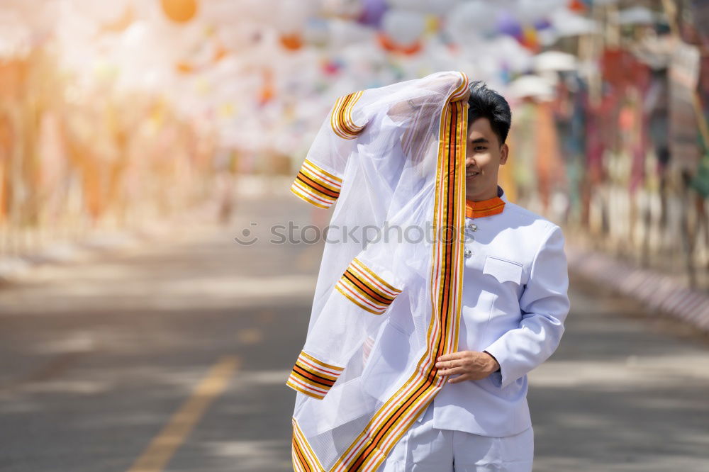 Similar – Image, Stock Photo Person in white cloth and gym shoes jumping on red carpet