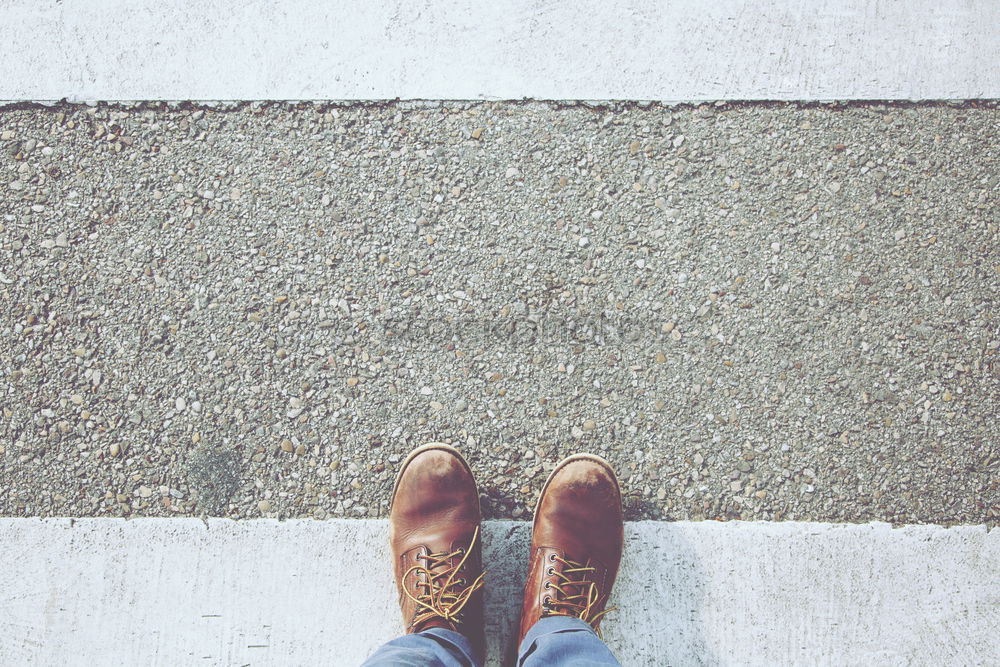 Similar – Two old brown shoes with red laces and youthful legs from above