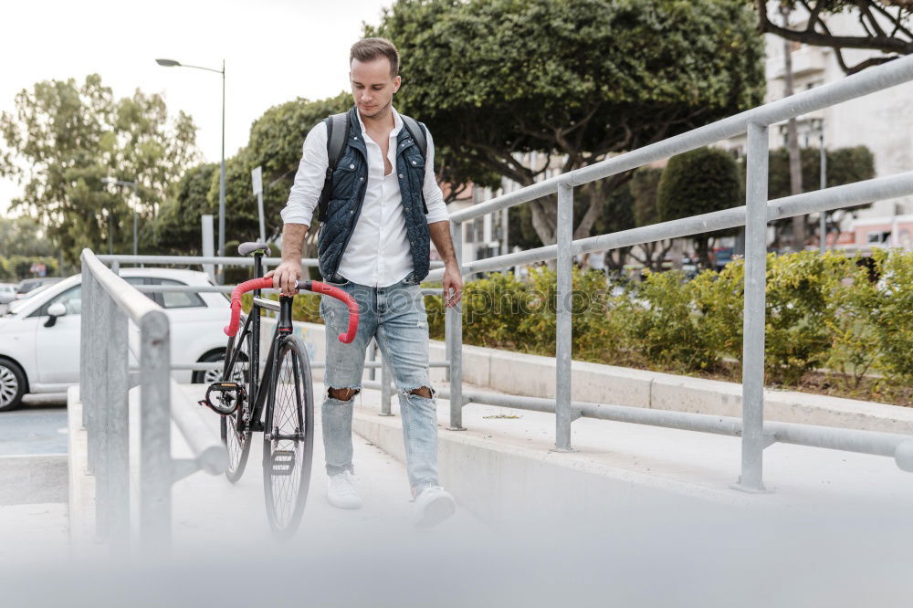 Similar – Man in the street wearing suit near a vintage bicycle.