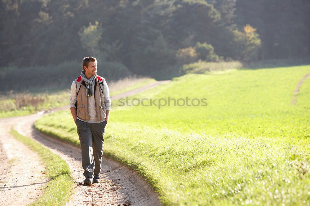 Similar – Image, Stock Photo Young man in a sunny autumn day