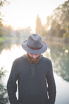 Similar – Bearded man in hat against sunlight