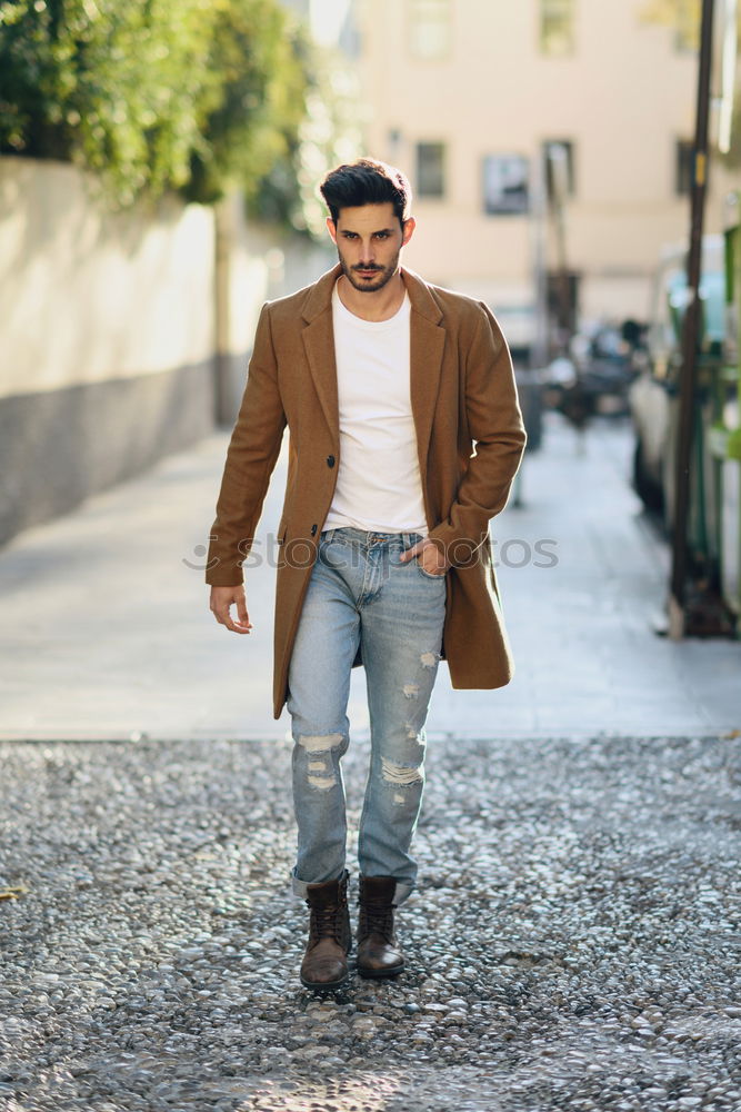 Similar – Young man wearing winter clothes in the street.