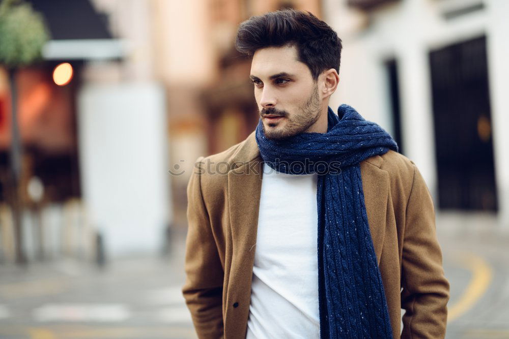 Similar – Young bearded man, model of fashion, sitting on urban step