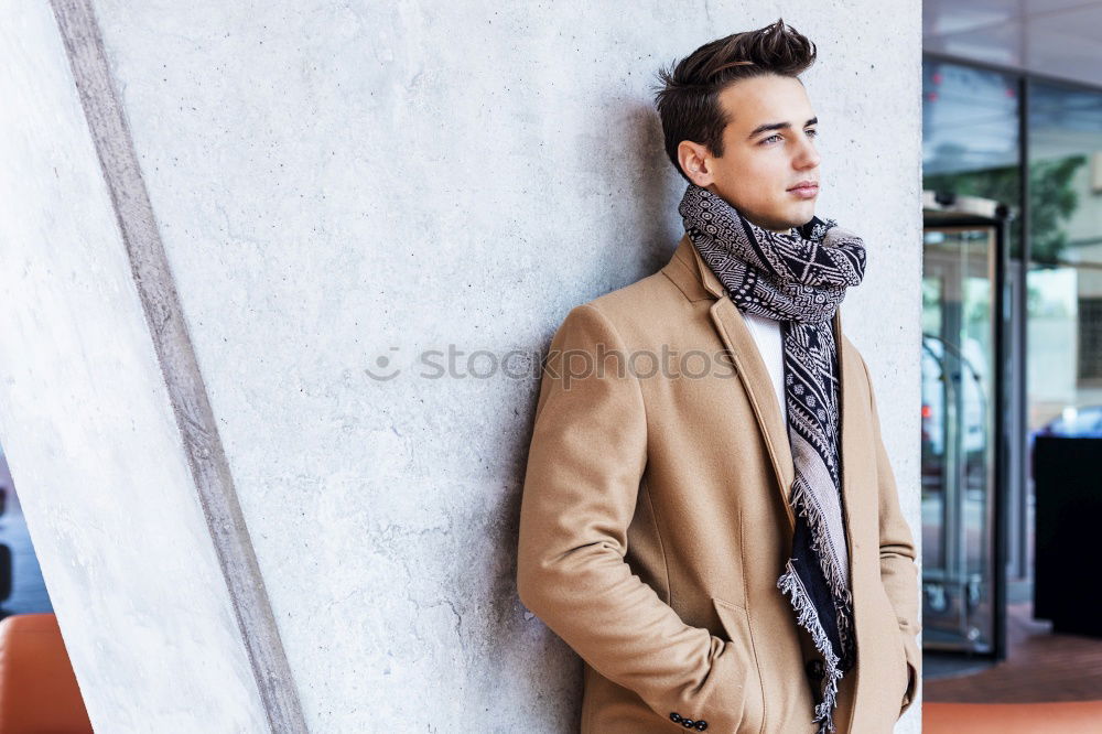 Similar – Image, Stock Photo Front view of trendy young man wearing coat and scarf