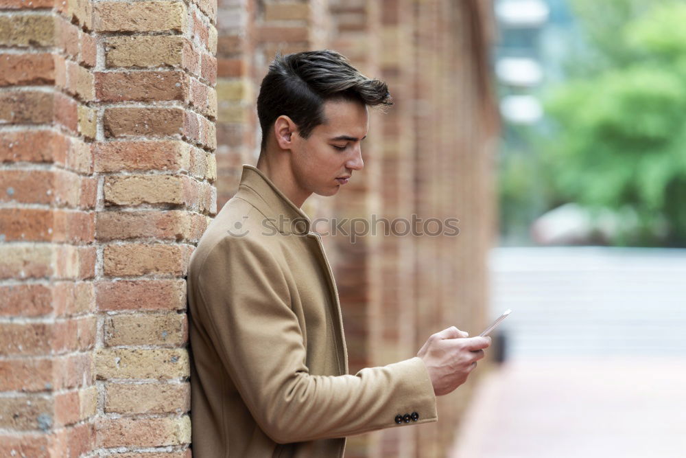 Similar – Image, Stock Photo Modern young man with mobile phone in the street.