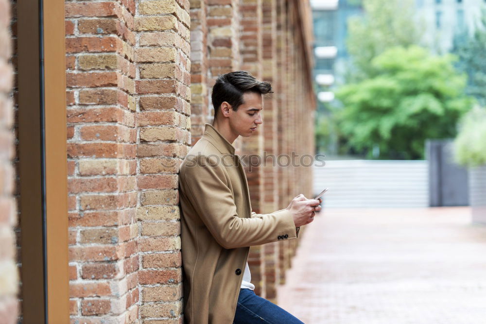 Similar – Image, Stock Photo Modern young man with mobile phone in the street.