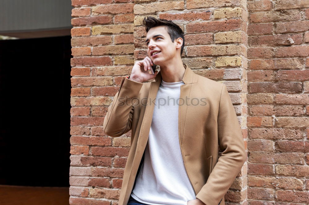 Image, Stock Photo Portrait of modern young man with mobile phone in the street.