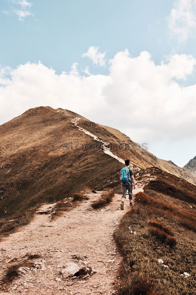 Similar – Image, Stock Photo Young woman on long-distance hiking trail