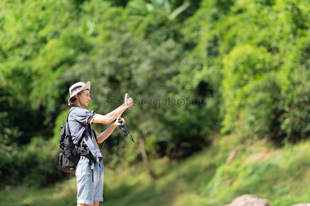 Similar – Couple kissing while making a break to do trekking