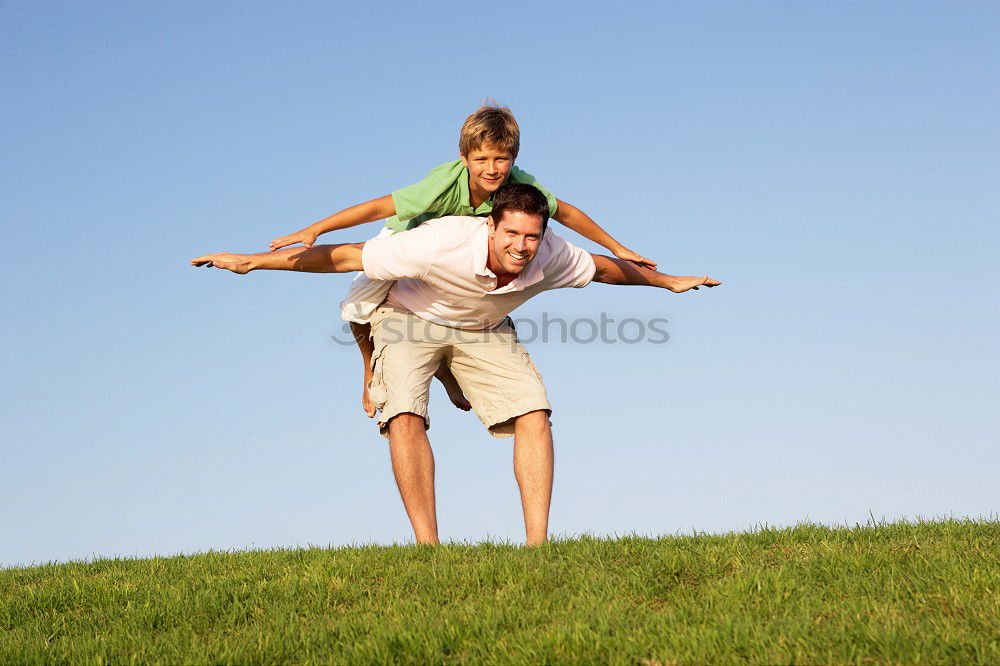 Similar – Image, Stock Photo Father and son standing on the road at the day time. Concept of tourism.