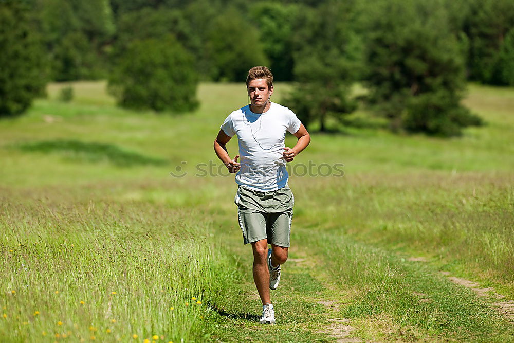 Similar – Image, Stock Photo Fit muscular man jogging on a rural trail