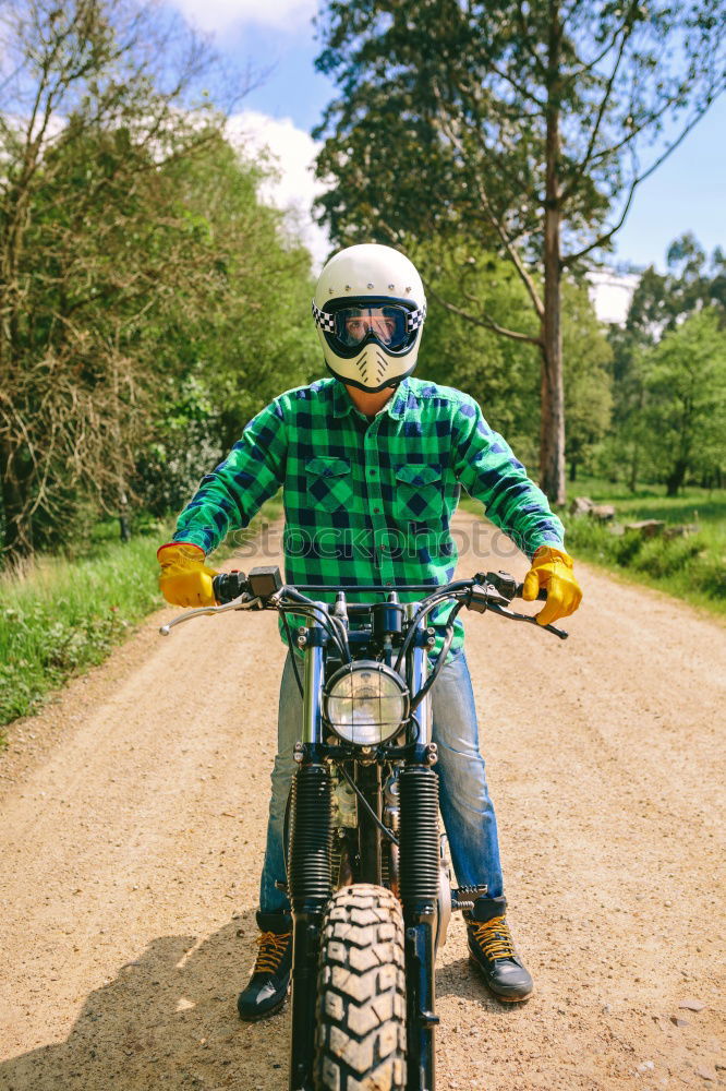 Similar – Man riding custom motorbike