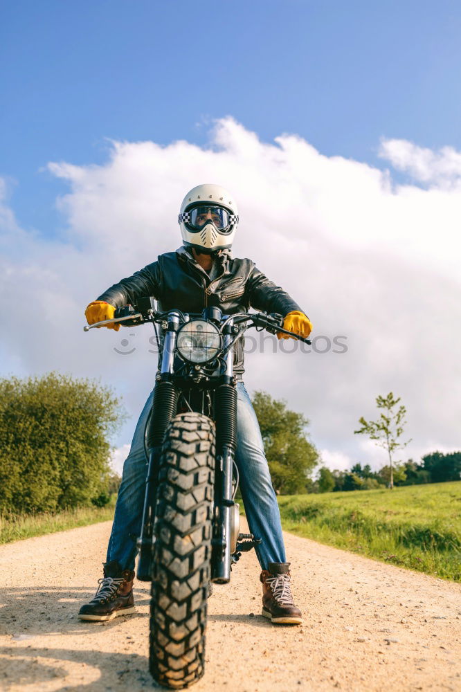 Similar – Man riding custom motorbike