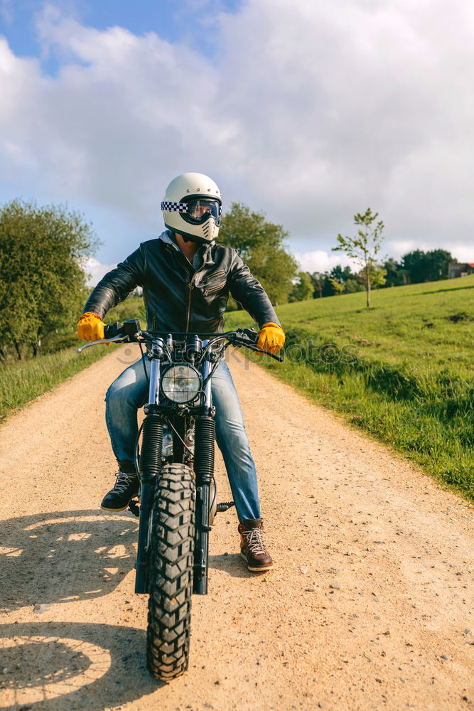 Similar – Man riding custom motorbike