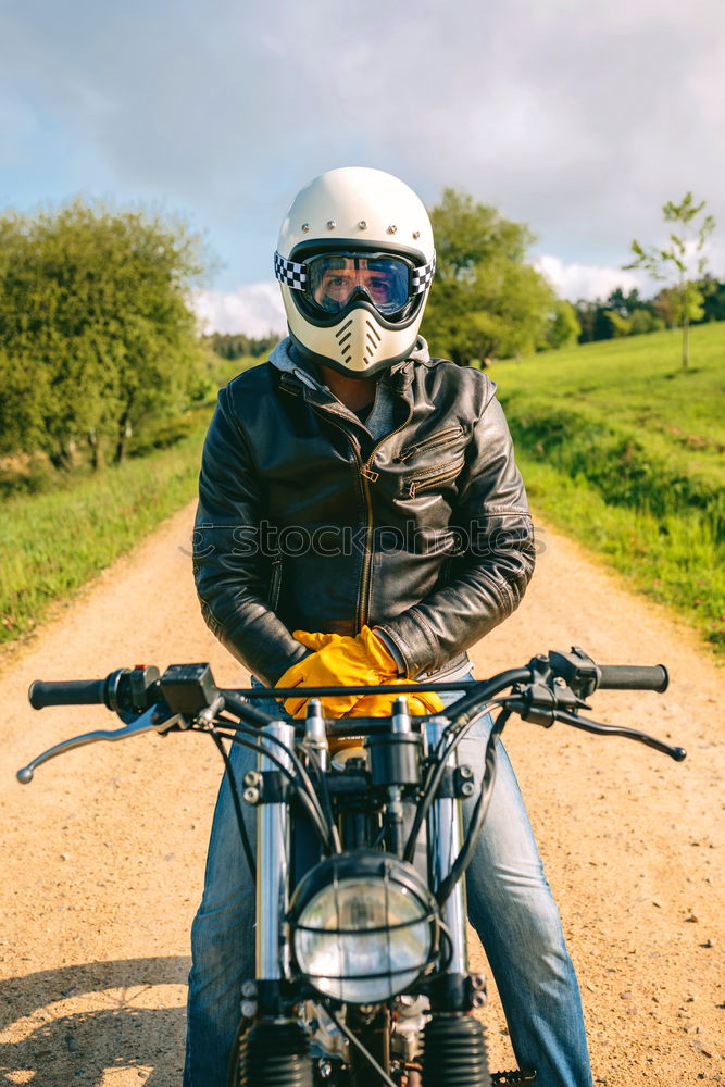 Similar – Man riding custom motorbike