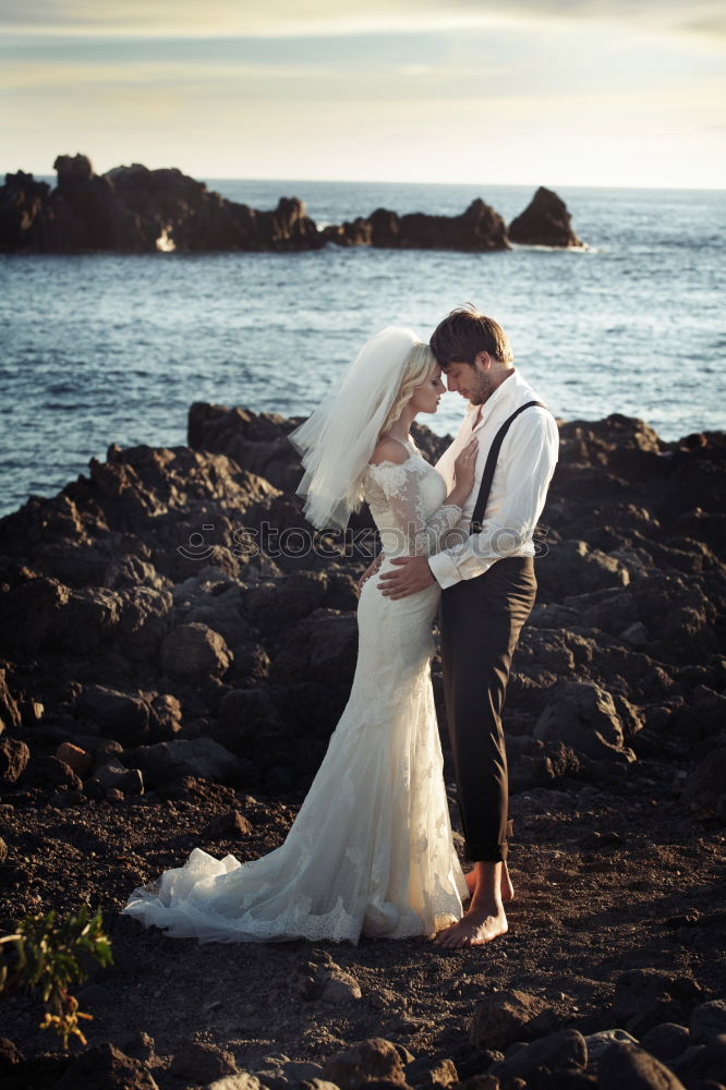 Similar – Image, Stock Photo Sensual wedding couple kissing on shoreline