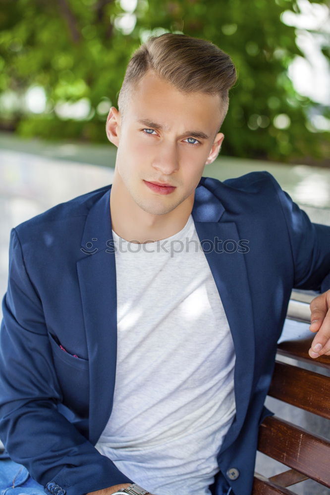 Similar – Businessman in urban background wearing blue suit