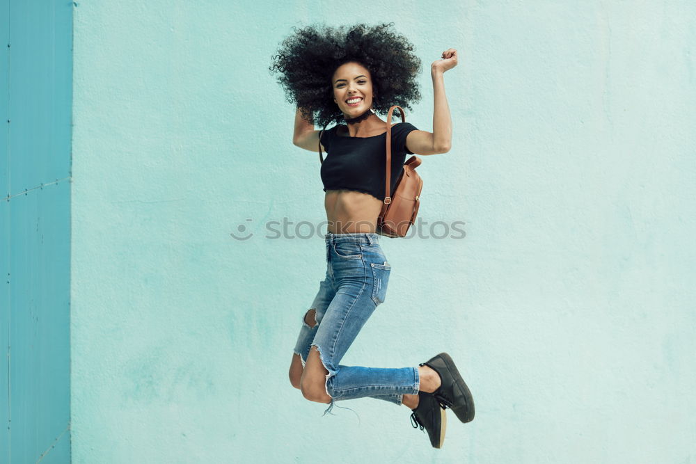 Similar – Woman with afro hair climbing by children’s attractions.