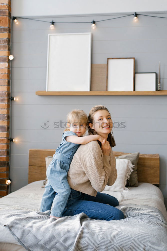 Similar – Image, Stock Photo happy mother and child son playing in bed