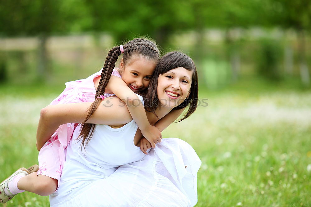 Similar – Happy mother and daughter playing in the park at the day time. Concept of celebration Mothers day .