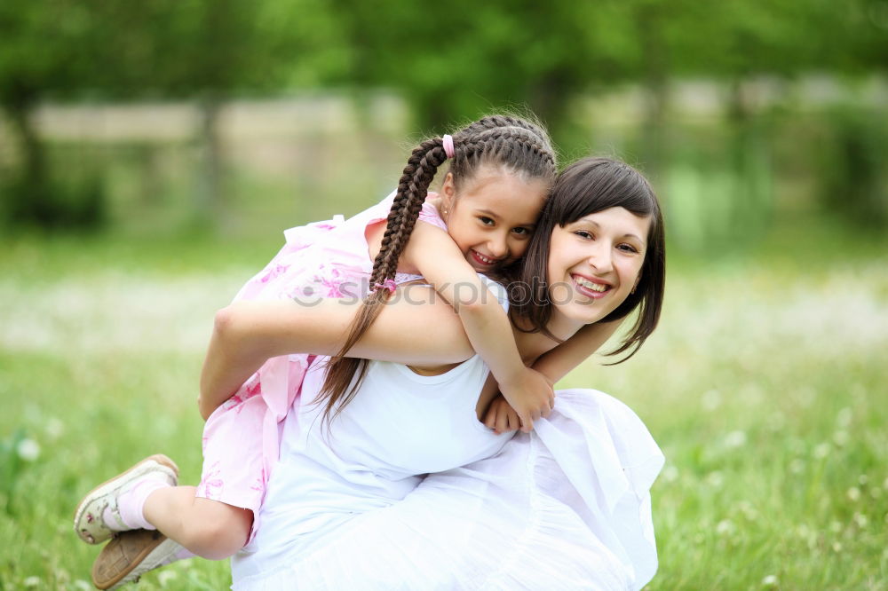 Similar – Happy mother and daughter playing in the park at the day time. Concept of celebration Mothers day .