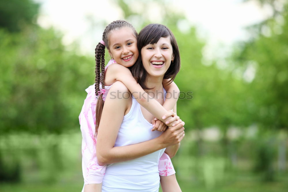 Similar – Happy mother and daughter playing in the park at the day time. Concept of celebration Mothers day .