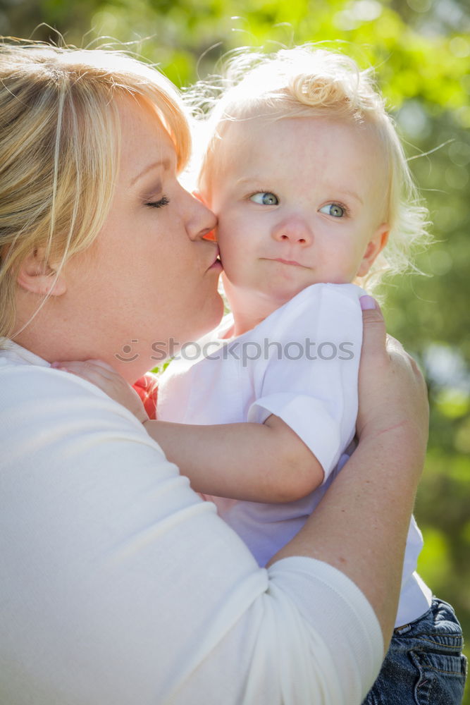 Similar – Image, Stock Photo Mother sitting with kid on hands