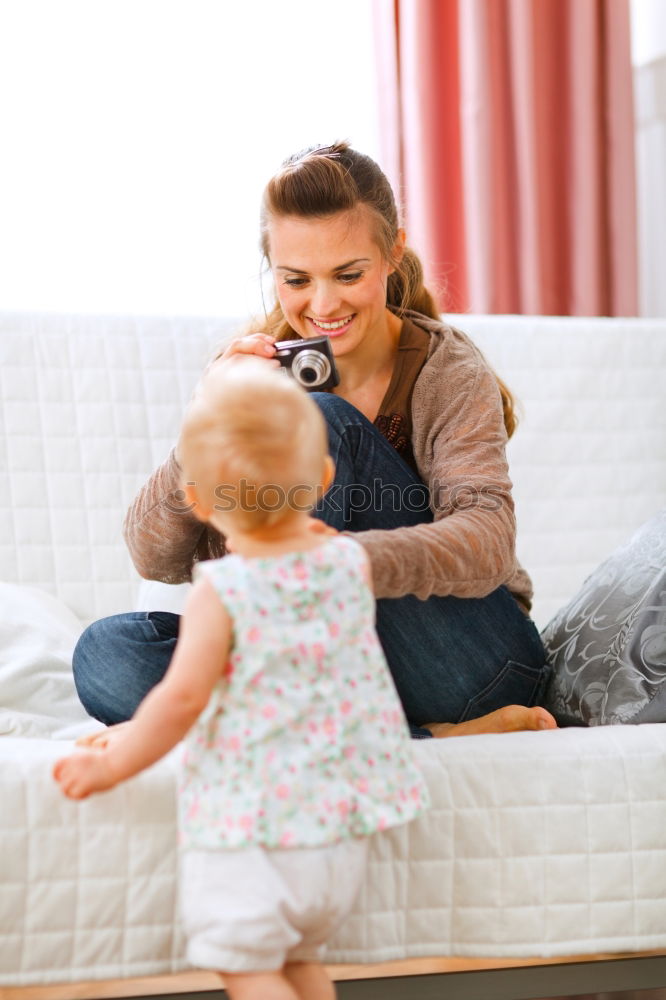 Similar – Image, Stock Photo Woman standing at the patio door with her little daughter