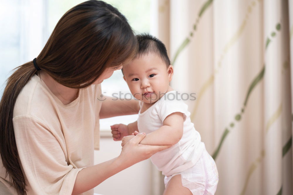 Similar – Image, Stock Photo Baby girl two months old smiling to her mother at home