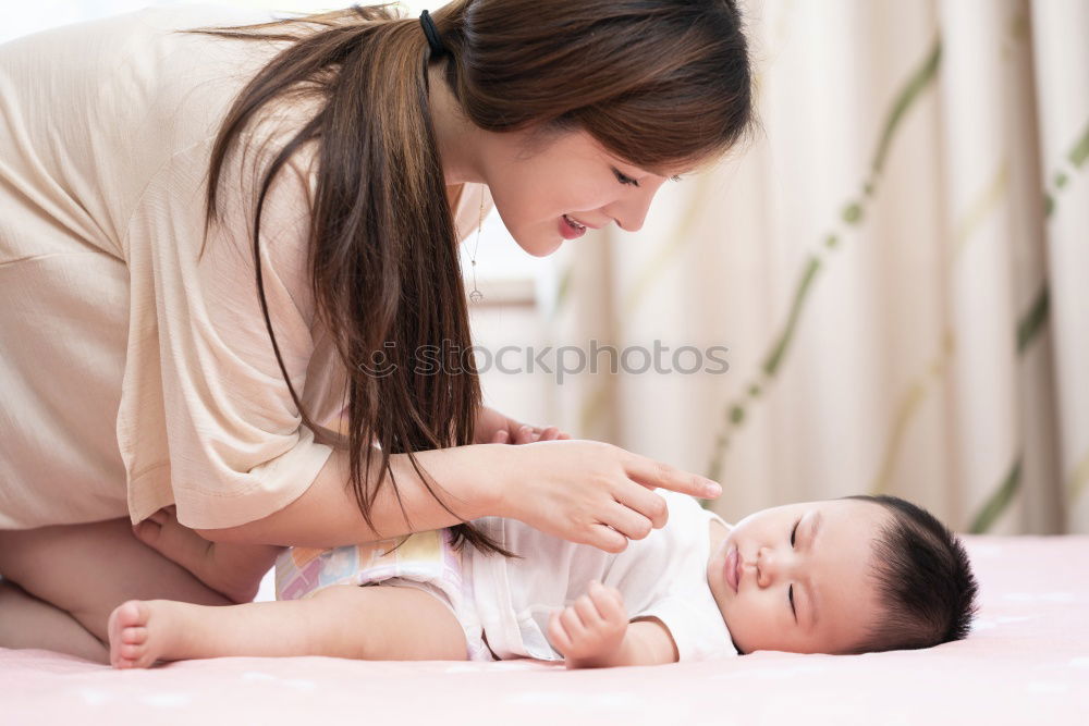 Image, Stock Photo Baby girl two months old smiling to her mother at home