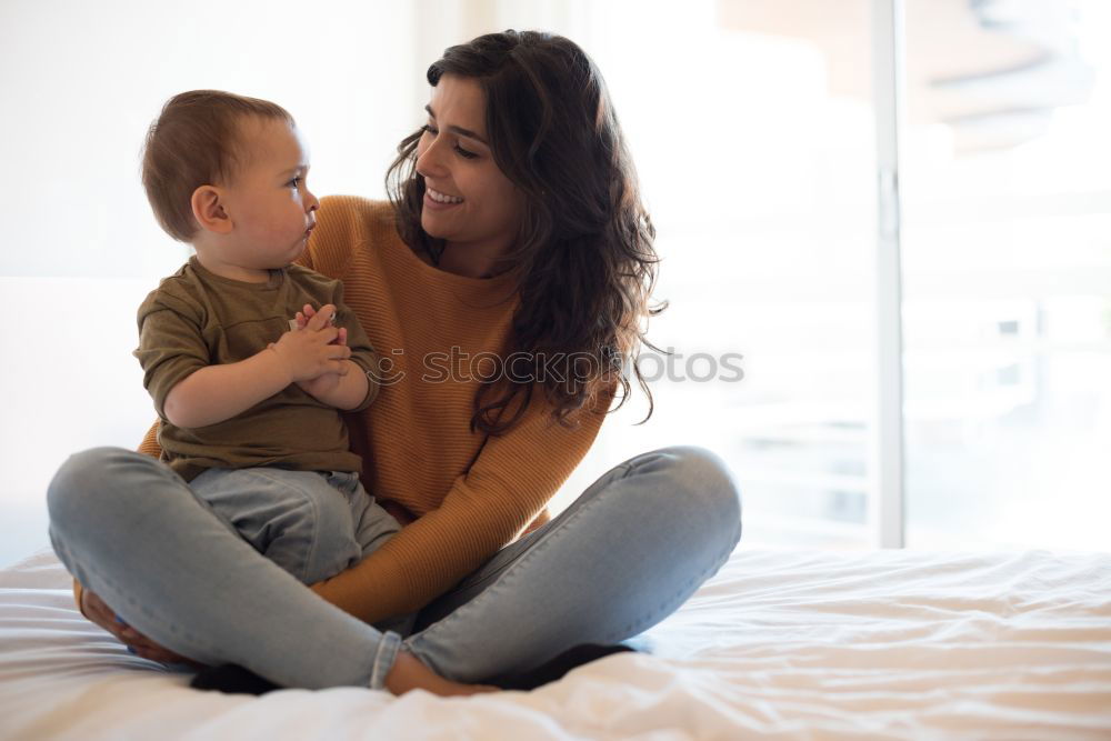 Similar – happy mother hugs her toddler son