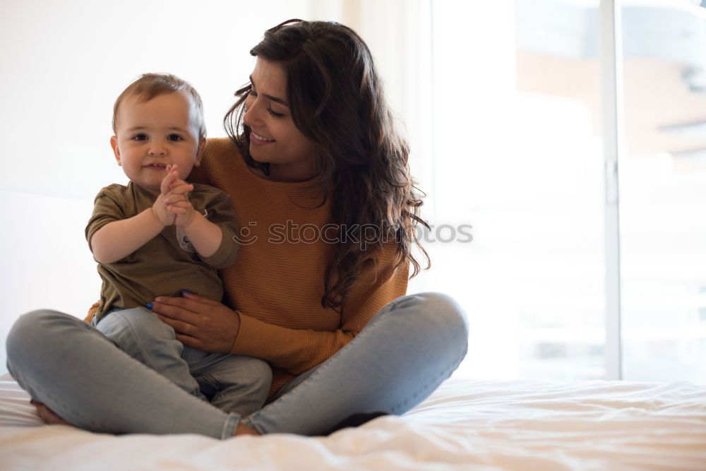 Similar – happy mother hugs her toddler son