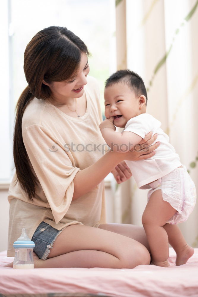 Similar – happy mother hugs her toddler son