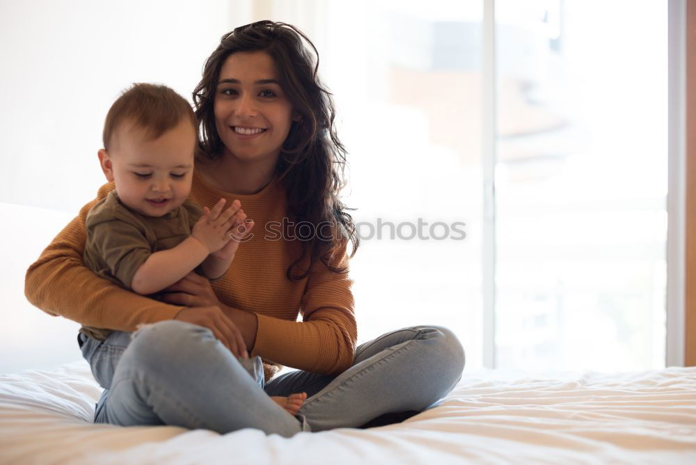 Similar – mother kissing little baby at bar terrace