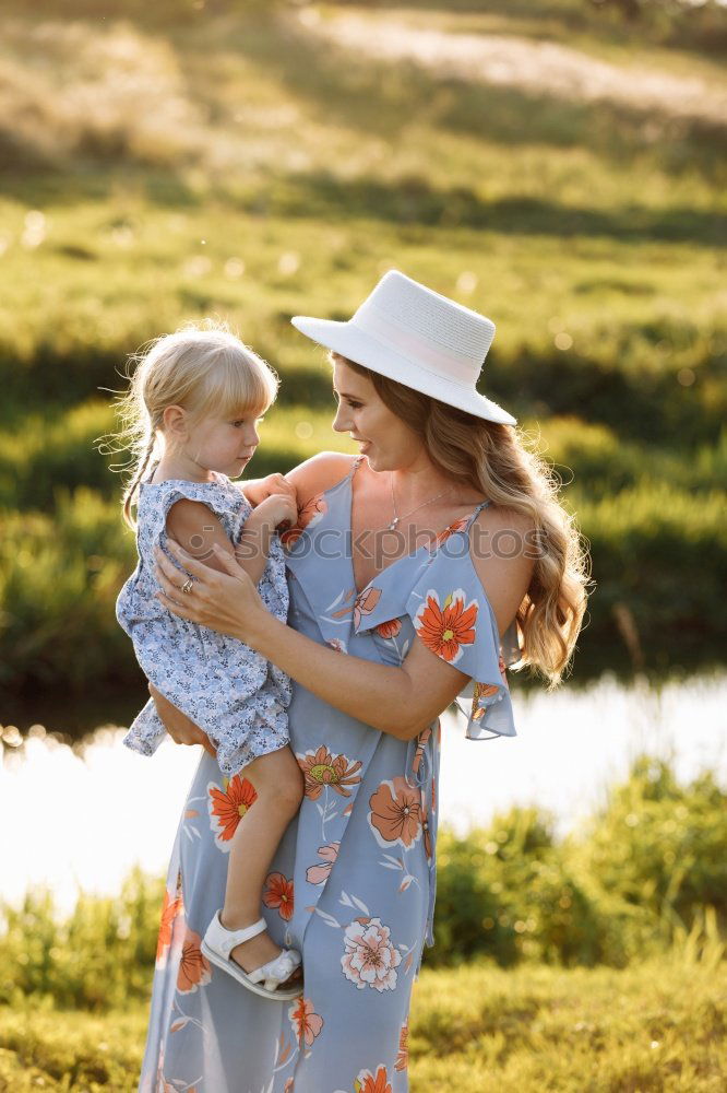 Similar – Image, Stock Photo Mother holding walking child