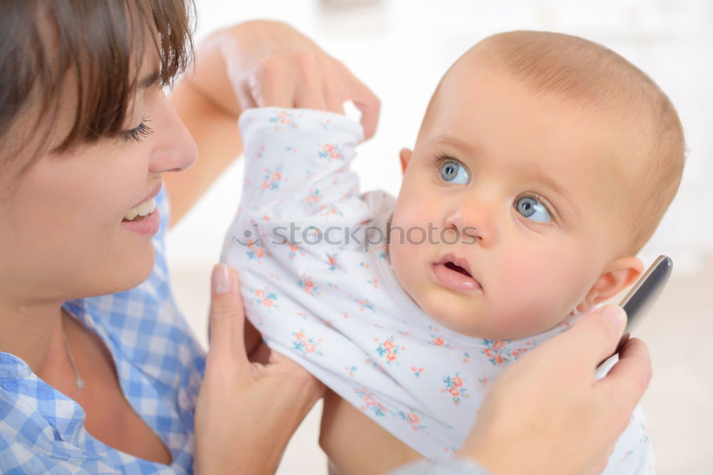 Similar – Image, Stock Photo Young mother breast feeding her baby at home
