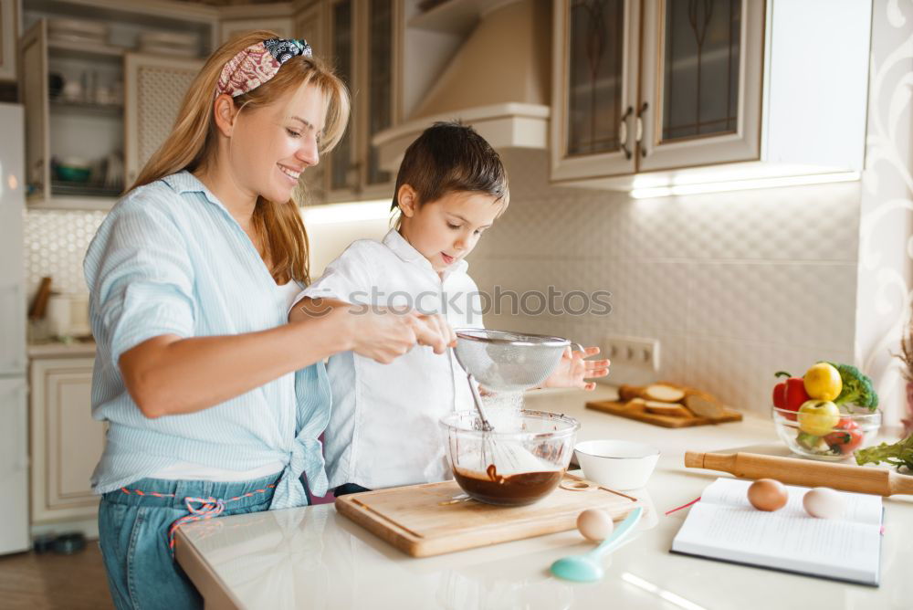 Similar – Image, Stock Photo Little sisters cooking with her mother in the kitchen.